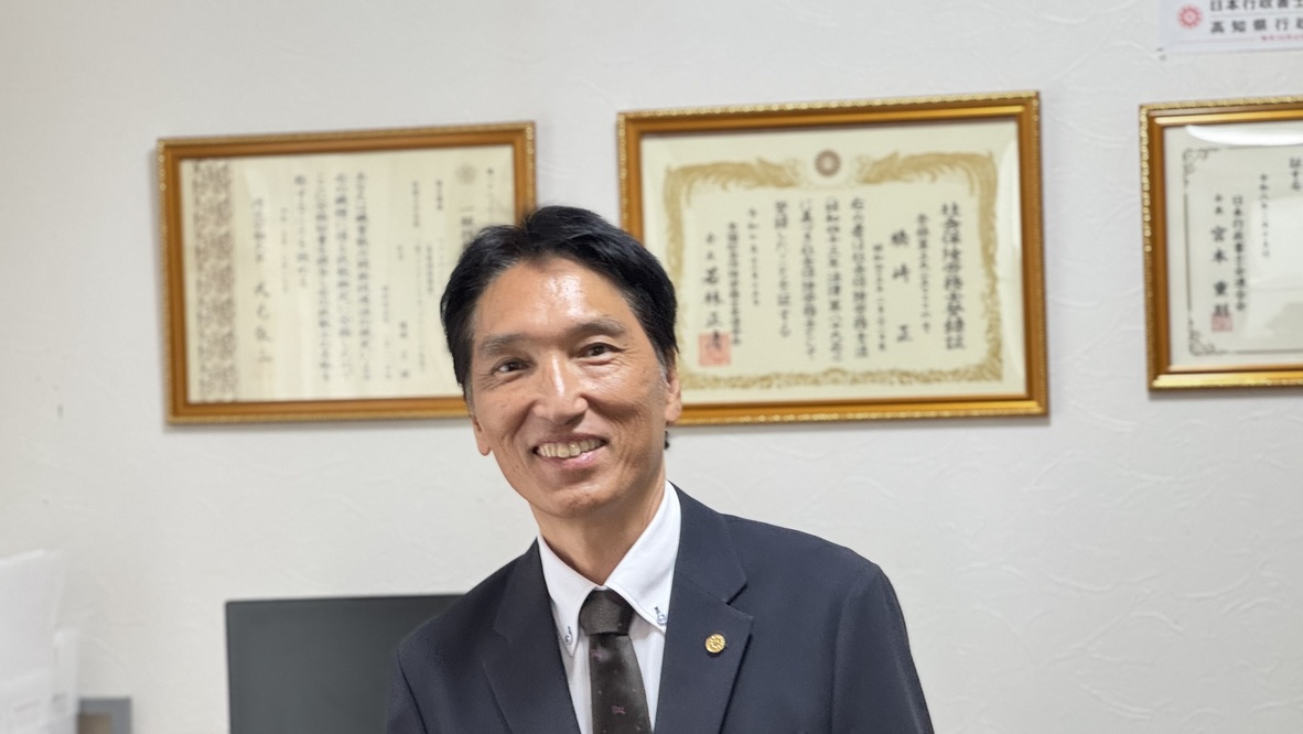 相談を受ける代表 橋崎正